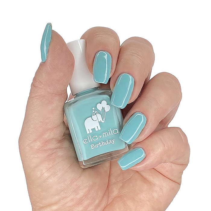 Plead the Fifth pastel turquoise nail polish manicure on a light skin tone with the bottle