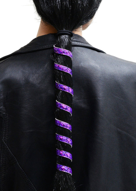Model wearing 12 inch dark purple holographic anodized aluminum ponytail wrap, spiral design, back view worn in a ponytail