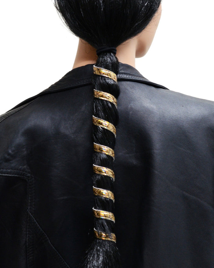 12-inch gold holographic leather ponytail holder wrapped around a long ponytail, spiral leather hair accessory worn by model and shown from the back