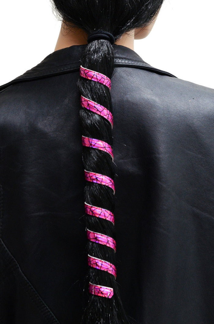 Model wearing 12 inch hot pink holographic anodized aluminum ponytail wrap, spiral design, back view in ponytail