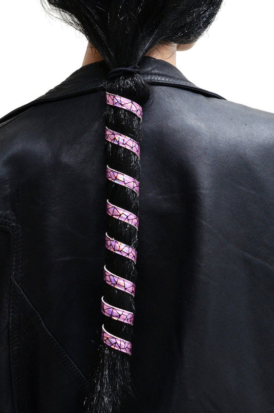 Model wearing 12 inch holographic pink anodized aluminum ponytail wrap, spiral design, back view in ponytail
