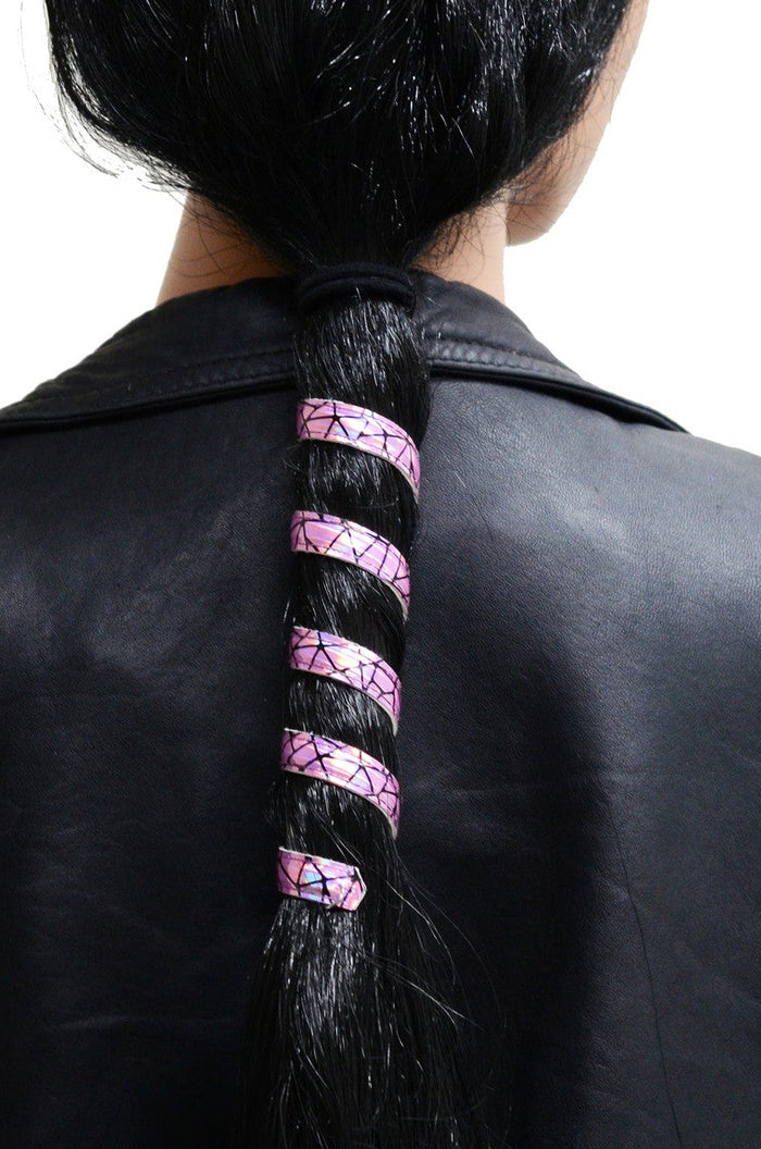 Model wearing 12 inch holographic pink faux leather ponytail wrap, spiral design, back view in ponytail