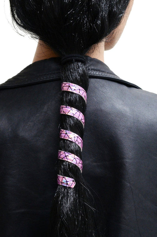 Model wearing 12 inch holographic pink faux leather ponytail wrap, spiral design, back view in ponytail