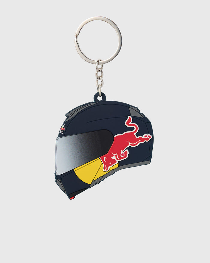 Black rubber racing helmet keychain with red bull logo, silver visor, and yellow stripe, attached to metal ring and chain.