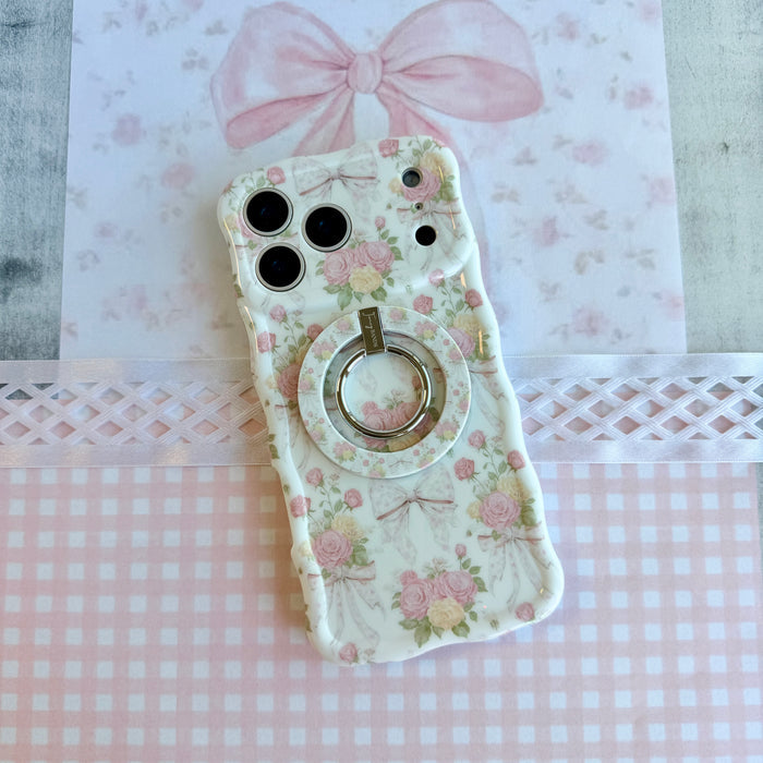 Ribbons and Roses coquette pattern MagSafe phone grip ring with pink roses and white bows on a white background compatible with iPhone and Samsung