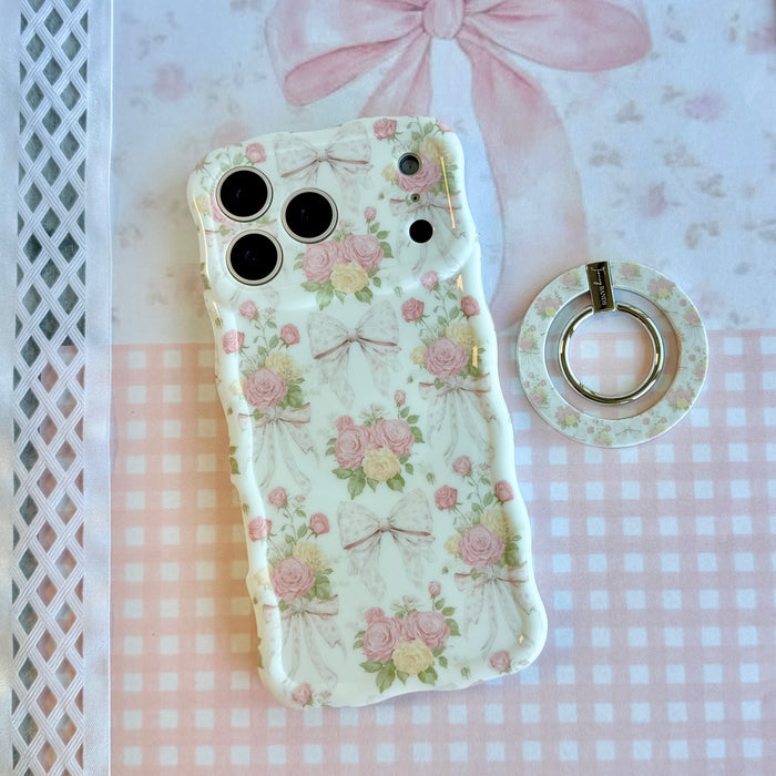 Ribbons and Roses coquette pattern MagSafe phone grip ring with pink roses and white bows on a white background compatible with iPhone and Samsung