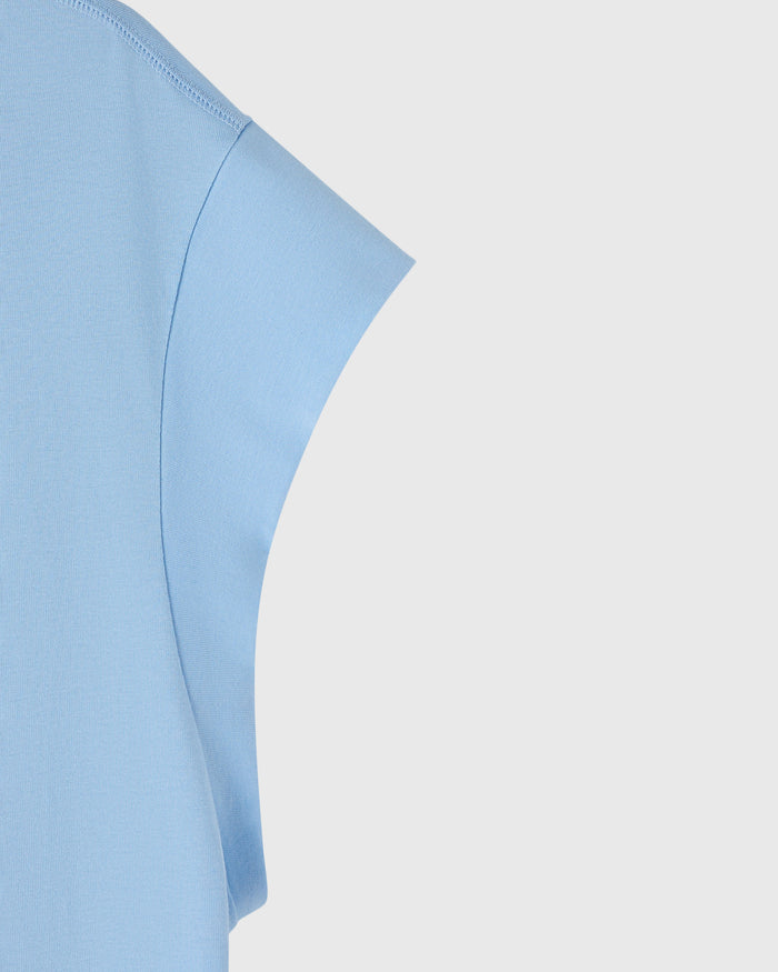 Light blue muscle tee with mesh print detail and fitted sleeves.