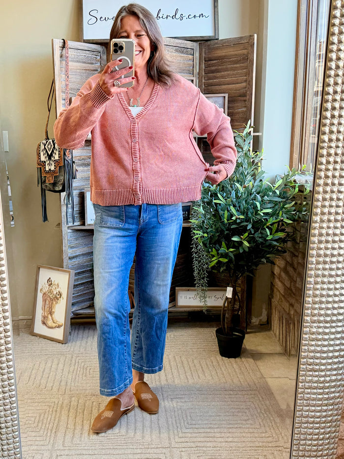 Dusty pink knit cardigan with button-front and ribbed cuffs, V-neck.