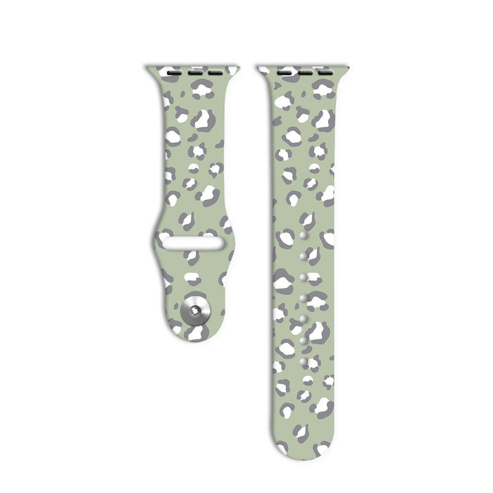 Two pieces of the Sage Leopard Apple Watch Strap by Coconut Lane are displayed against a white background. The strap features a light green base color with a gray and white leopard print pattern, reflecting its unique style from the Sage Leopard Collection.