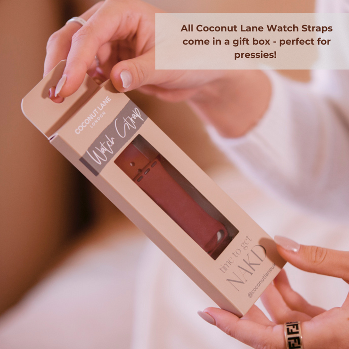 A person holds a Coconut Lane gift box. The box displays a Sage Leopard Apple Watch Strap inside. The text on the image reads: "All Coconut Lane Apple Watch Straps come in a gift box - perfect for pressies!