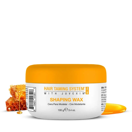 GK Hair Shaping Wax 100 g white jar with an orange lid, beside honeycomb and dripping honey on white