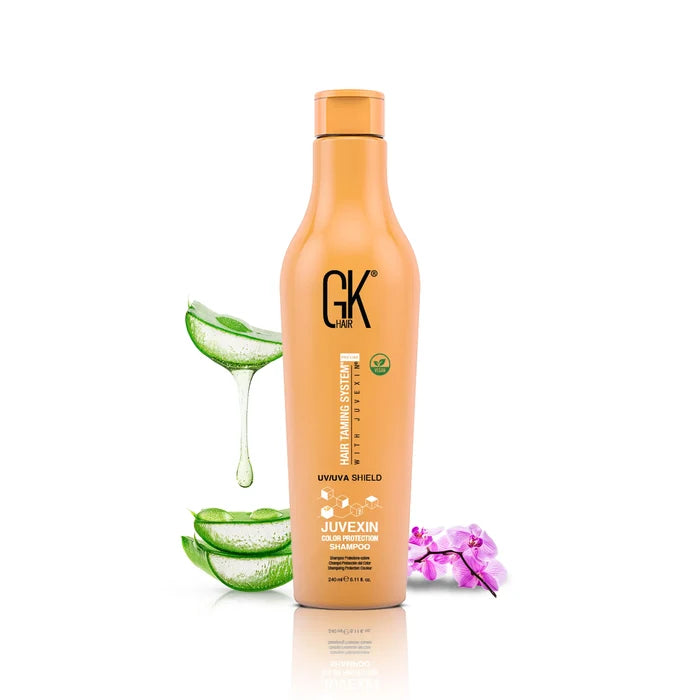 Shield Shampoo & Conditioner: the 240 ml orange Juvexin Color Protection Shampoo bottle alone beside dripping aloe vera