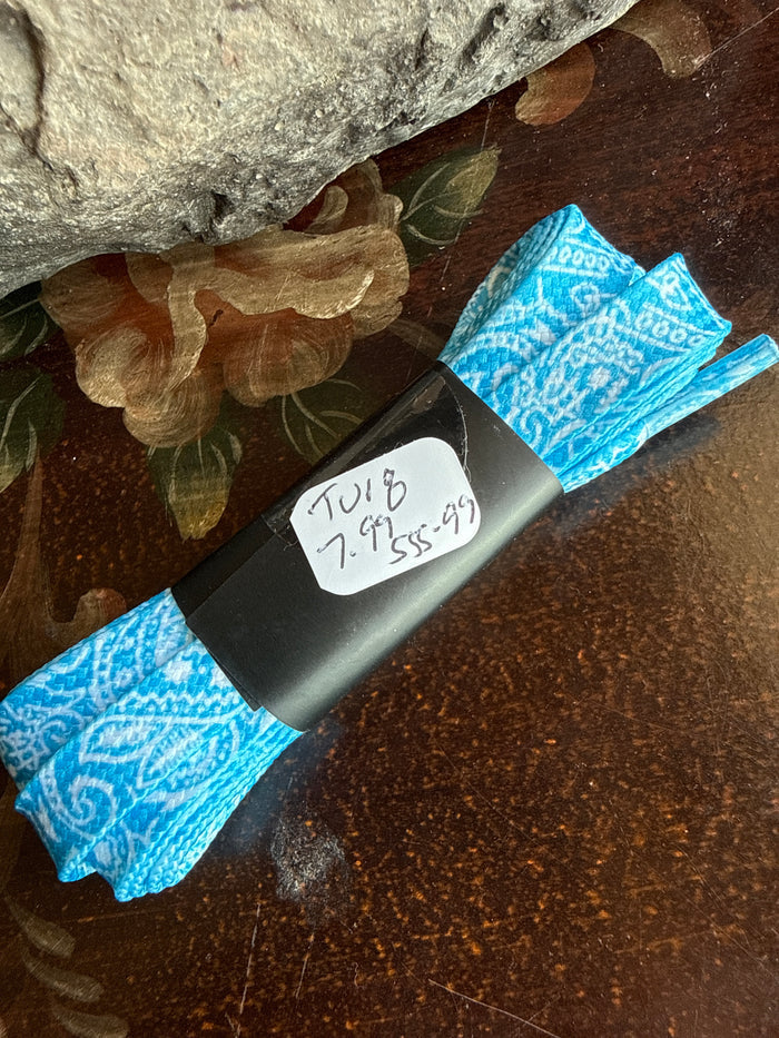 Turquoise blue paisley shoelace pair with white swirl pattern