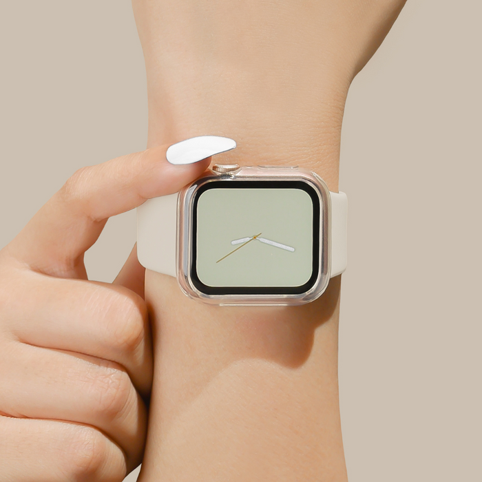 A hand with white nails points to an Apple Watch in a clear Coconut Lane silicone case.