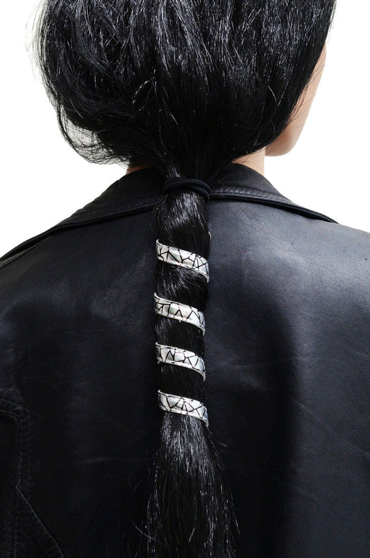 Model wearing 6 inch holographic silver faux leather ponytail wrap, spiral design, back view in ponytail