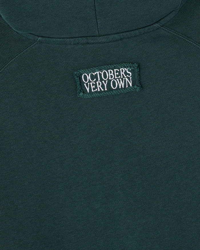 Midnight green sleeveless hoodie with "October's Very Own" woven label on chest.