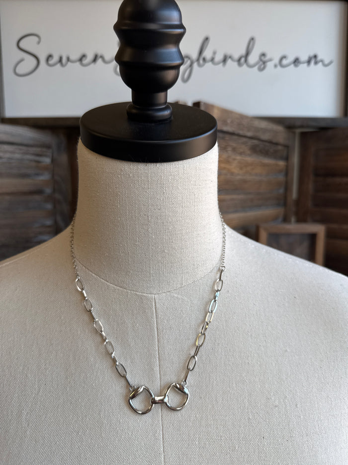 Snaffle bit necklace with silver-tone chain and double-ring snaffle pendant