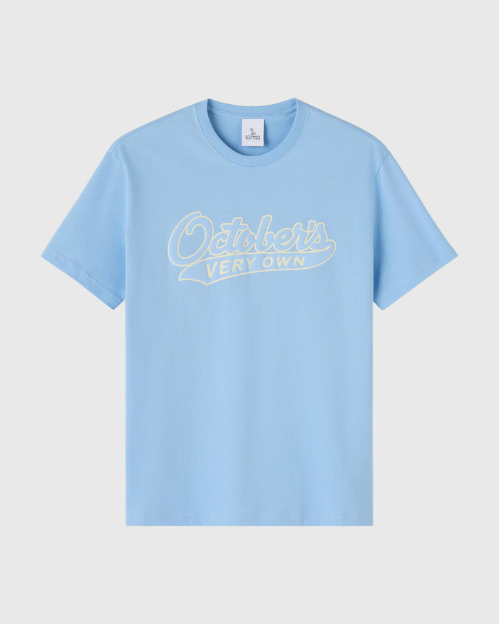 Light blue t-shirt with cream script text reading "October's Very Own" across the chest.