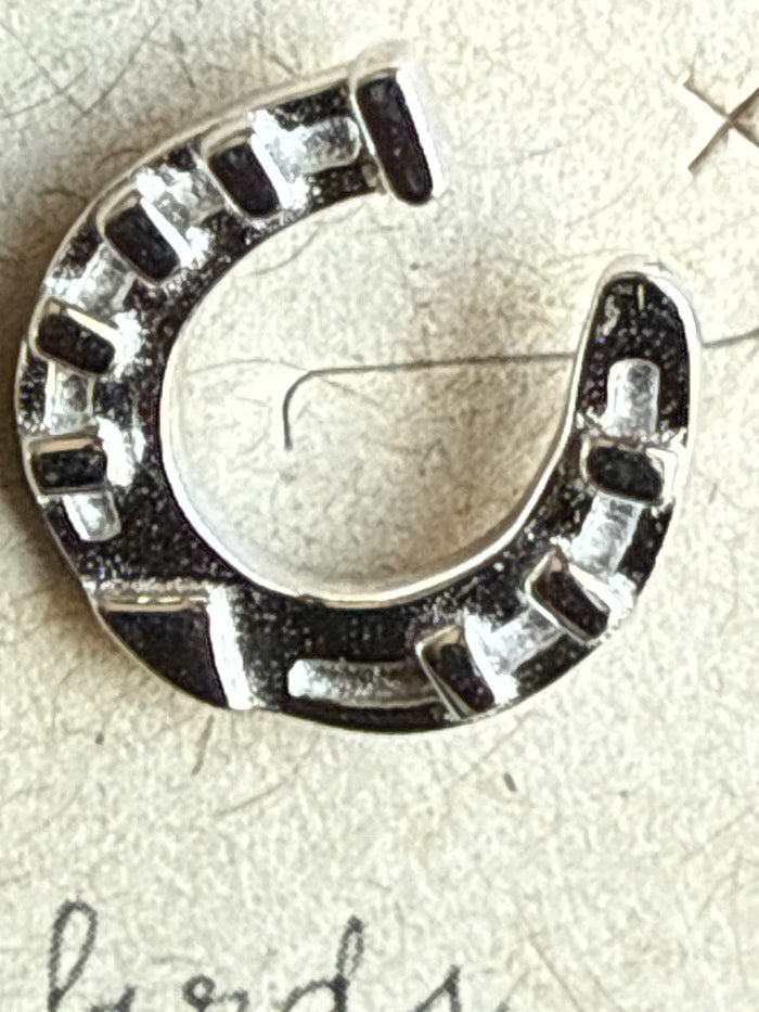 Sterling silver horseshoe earring with square-cut stone accents, close-up open arc