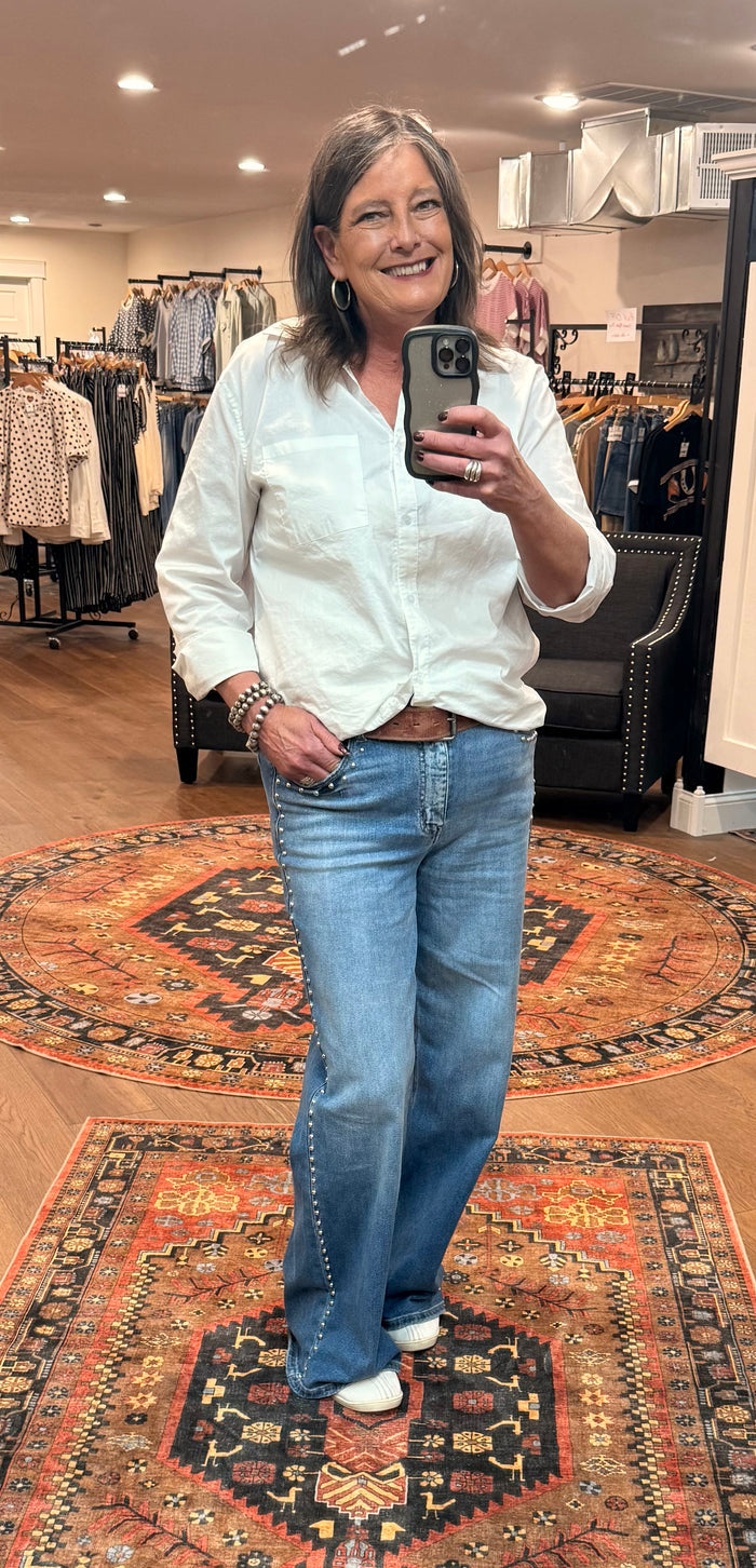 Light blue studded wide-leg denim jeans with side studs, relaxed fit
