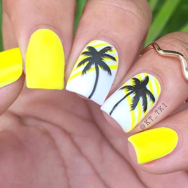 Sunburst yellow nail polish with black palm tree accent nail art