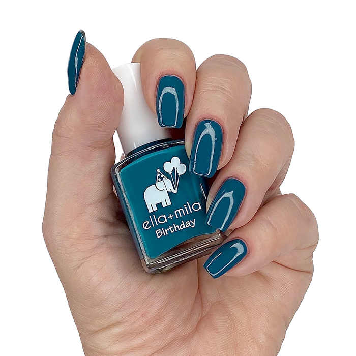 Third Time's a Charm teal blue nail polish manicure on a light skin tone with the bottle