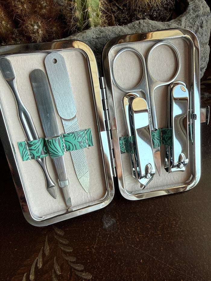 Turquoise-trim manicure set open case with nail clippers and tools