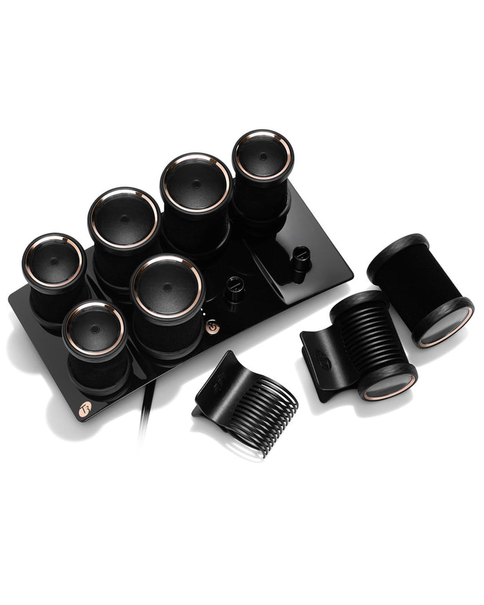Set of black hair rollers on a white background
