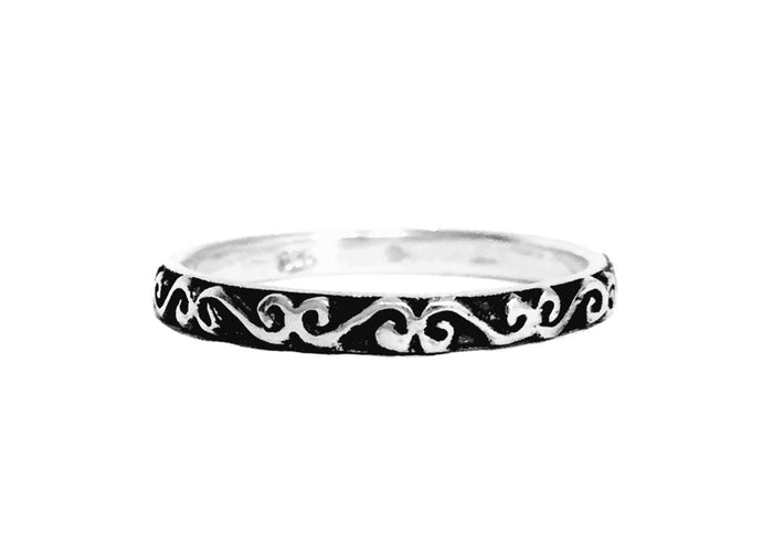 Sterling silver Celtic spiral band ring with oxidized detail, minimalist design, front view on white background