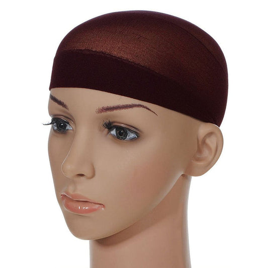 The Perfect Locks Wig Cap in brown fits securely on a mannequin head with light skin, painted brows, long lashes, and pink lips—ideal for displaying human hair extensions.#color_black