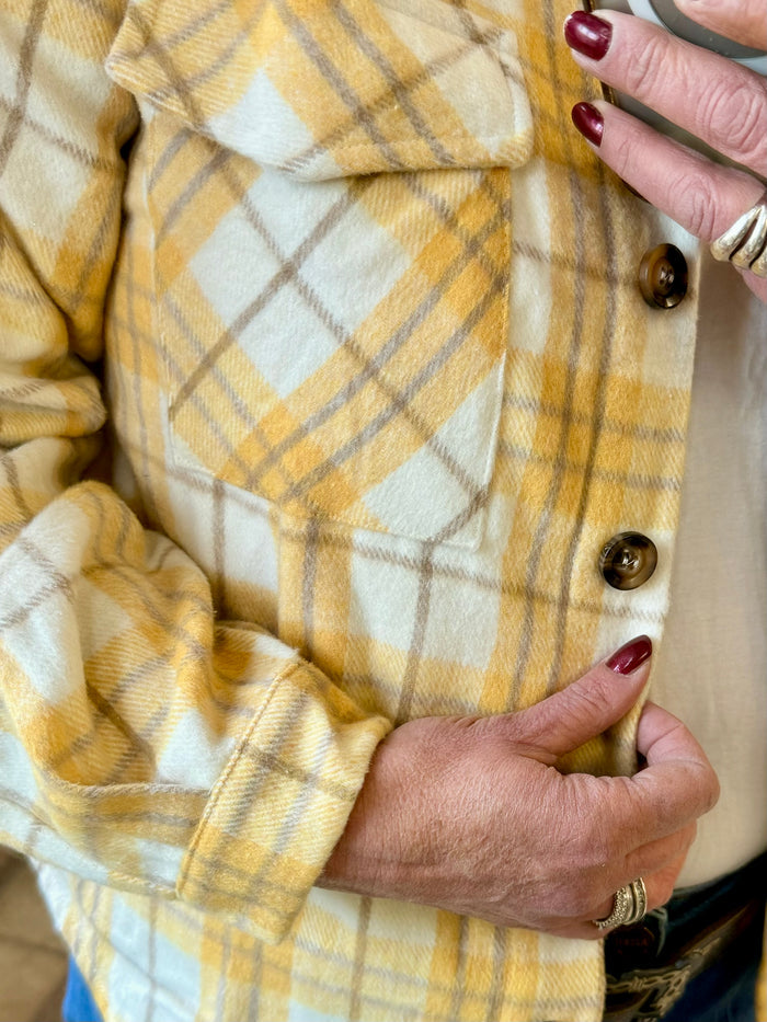 Yellow plaid shacket with wooden buttons and chest pocket
