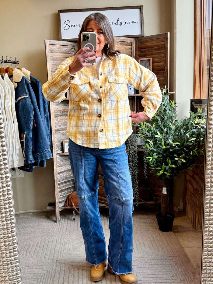 Yellow plaid button-front shacket worn over blue jeans